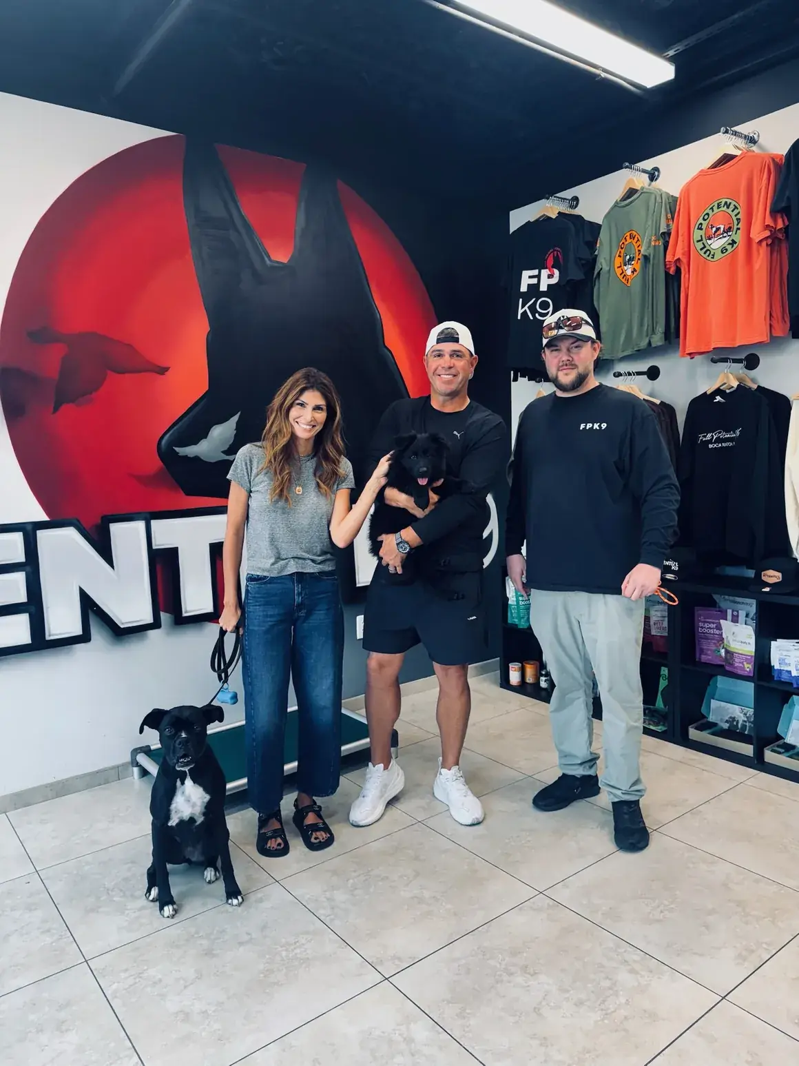The Full Potential K9 team with dogs inside the Boca Raton training facility